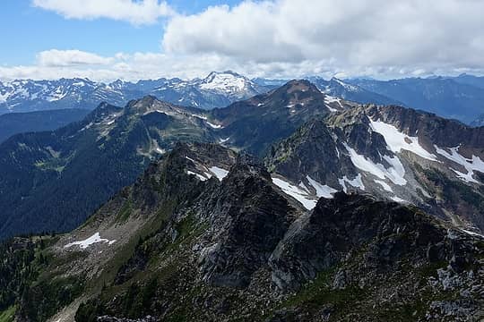Looking back at Painted and Magenta from the summit of Black, with Sloan Peak in the distance