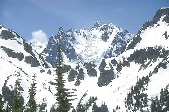 On the north approach from Hannegan Pass, Mt. Shuksan becomes visible through a notch in the ridge to the west.