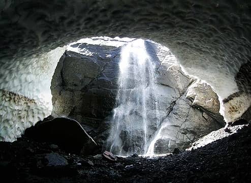 Snow cave and waterfall