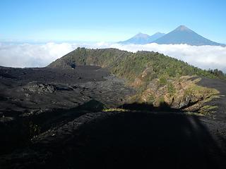 the main lava flow below from several years prior and Fuego, Atitlan, and Acatenango in the distance