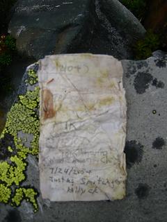 The "summit register" was a few scraps of wet paper in a plastic film can. Note Justus' climb in '04