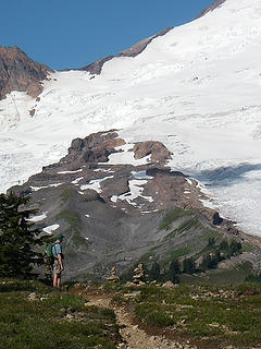 A hiker admires Mt Baker from the Park Butte Lookout trail