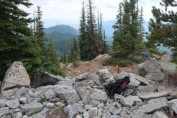 lookout site  set on granite base. Just above my pack is an orange waterproof match case that held Fay's register, placed on 11/13/18. The lookout was a cupola cabin built in 1922 and destroyed in 1974.