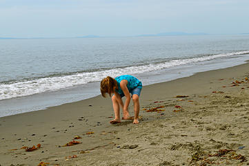 Abby pretending to dig for clams