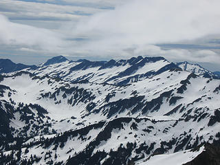 Looking SE from Black Mt.  Background:  left, Saul; right, Indian Head.  Foreground (blends with background): right, White Mt.; follow ridge to Pt 6770 at left, where trip ends (see panos taken from there).