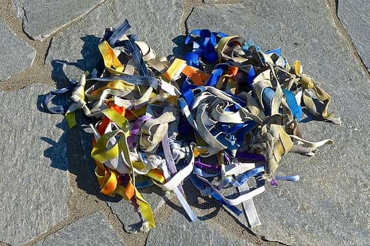 Pile of old webbing removed from rappel anchors