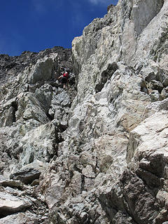 Climbing up the class 4(?) gully below Dumbbell's summit.  Good foot and handholds make it fairly simple.