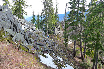 The first set of large rock outcrops on the ridge. On the way down we knew we could pass the lower set on the north.
