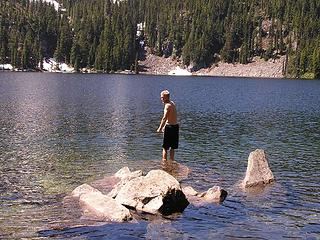 Texas Tony contemplating the refreshing waters of an alpine lake