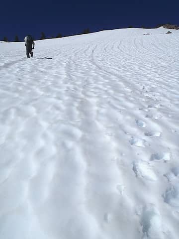 Steep snow ascent to ridge