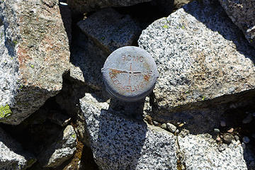 Beyond the north summit I found this survey marker. It says "BCMC Keechelus Peak". My guess is that BCMC stands for Bear Creek Mining Company that sponsored mineral exploration here in the 60s when the peak was first climbed.