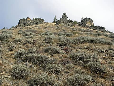 Rock formations along the slope of a ridge highpoint.