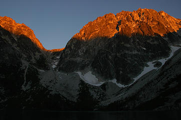 Alpenglow on Dragontail and Aasgard Pass above Colchuck Lake as the suns light dies and reflects off the mountain tops.