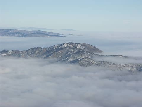 Horse Lake Mountain aka Twin Peaks sticks out of the fog with Burch Mtn. in the background.