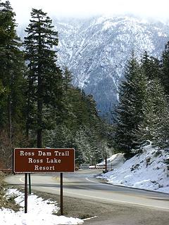 Trailhead, closed Hwy and mountains with spring snow