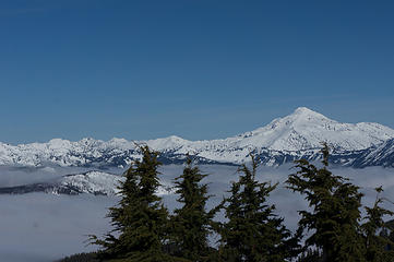 Glacier Peak from Jove Peak, with fog due to inversion hanging in the valleys