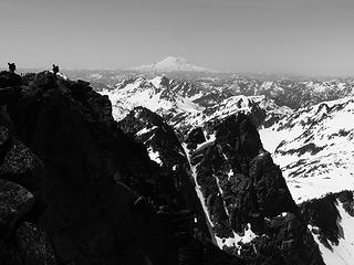 Climbers on Eightmile Mountain with Mount Rainier in the distance (black and white)