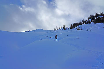 Steve descending the highly variable snow covered basalt terrain.