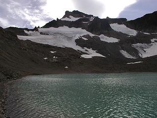 Cold lake with mt Curtis and conrad glacier