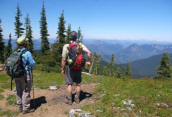 Hikers look toward Snoqualmie Pass from Noble Knob