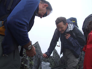 Inspecting the contents of the Geo-cache on the summit of Web Mountain.