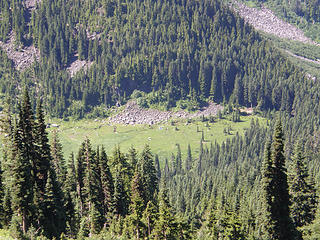 Looking down at the meadow/tent from where we came on upper slopes of Rock Mtn.
