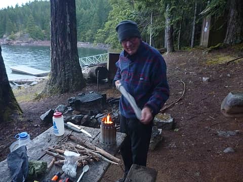Dave Dailey, drying socks over bigger wood stove on May 28, 2016 at Devils Landing