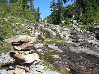 Head upstream at the large cairn
