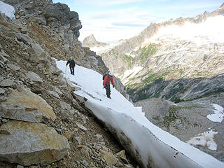 Yana and Dicey look for a way down from the pass