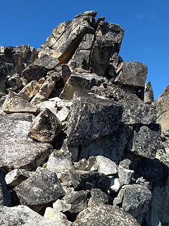 Above the crux chimney, summit in sight