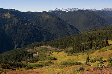 Looking down at the North Fork of the Sauk River, with Monte Cristo Peaks in the distance and the avalanche area at the lower left.