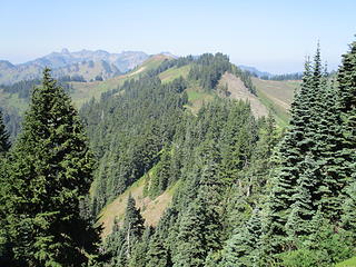 View back west along High Divide, with  bald Excelsior visible in center and Church-Bearpaw in distance.