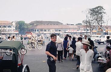 Near the Saigon Central Market. Then, as now, always a camera at the ready.