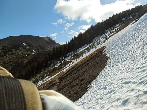 Looking back toward Marmot Pass, very hard snow across the trail (crampons required)