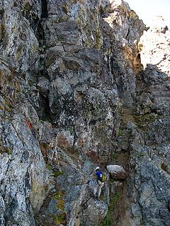 Dicey at the base of the chimney.  Her belay nest was atop the large boulder at right.  The Narrow Ledge comes in from bottom left.