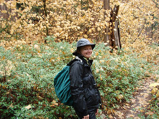 Fran on the trail with Fall colors in the background...