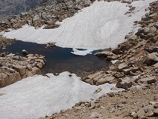 Two snowfields converge near the summit.
