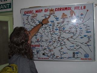 Kim pointing out Gangotri on the map at the GMVN hotel in Uttarkashi