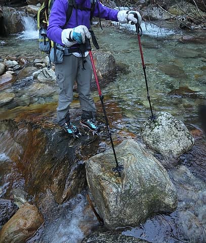 Crossing East Fork Newhalem Creek with crampons for the slippery rocks