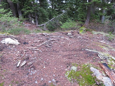 What is left of the old storage cabin, just before the steep part to the summit.