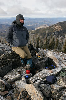 Dave boils a cup of tea on the summit of Sherman Peak, elevation 6,998.' Kettle River Range, Washington.