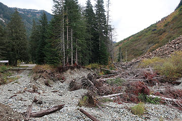 not easy to repair. The diverting rockfall is visible on right, former road end on left.