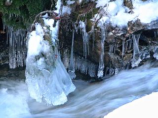 Creek flow with ice brush