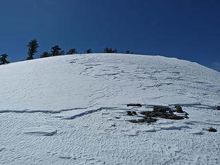 Windblown section with light crust and deep powder beneath.