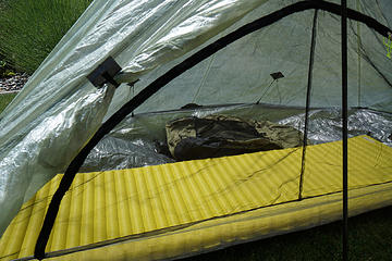View through bug netting with thermarest and arcblast pack side by side.