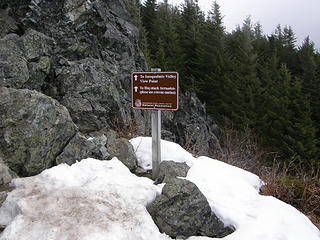Traditiona sign near top of rocks Mt Si trail. It's melting out for sure but not today. Pretty cool up here now. Freezing level said to be 3500 feet.