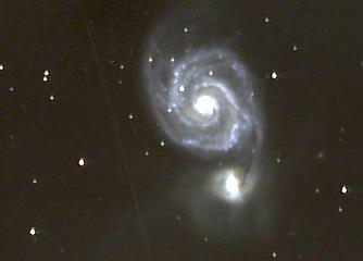 The Whirlpool Galaxy and companion in a 38 minute exposure. The diffuse gas cloud surrounding the companion galaxy is clearly visible.