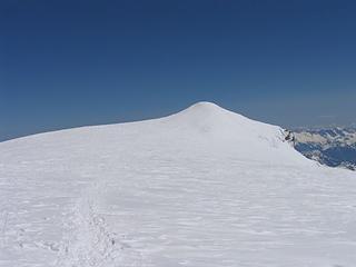 Looking across the summit plateau at the true summit