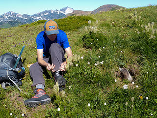 Marmot supervising Jake as he ties his boots