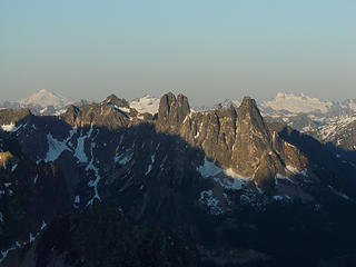 The Liberty Bell now illuminated with sun.  Glacier Peak and Dome behind